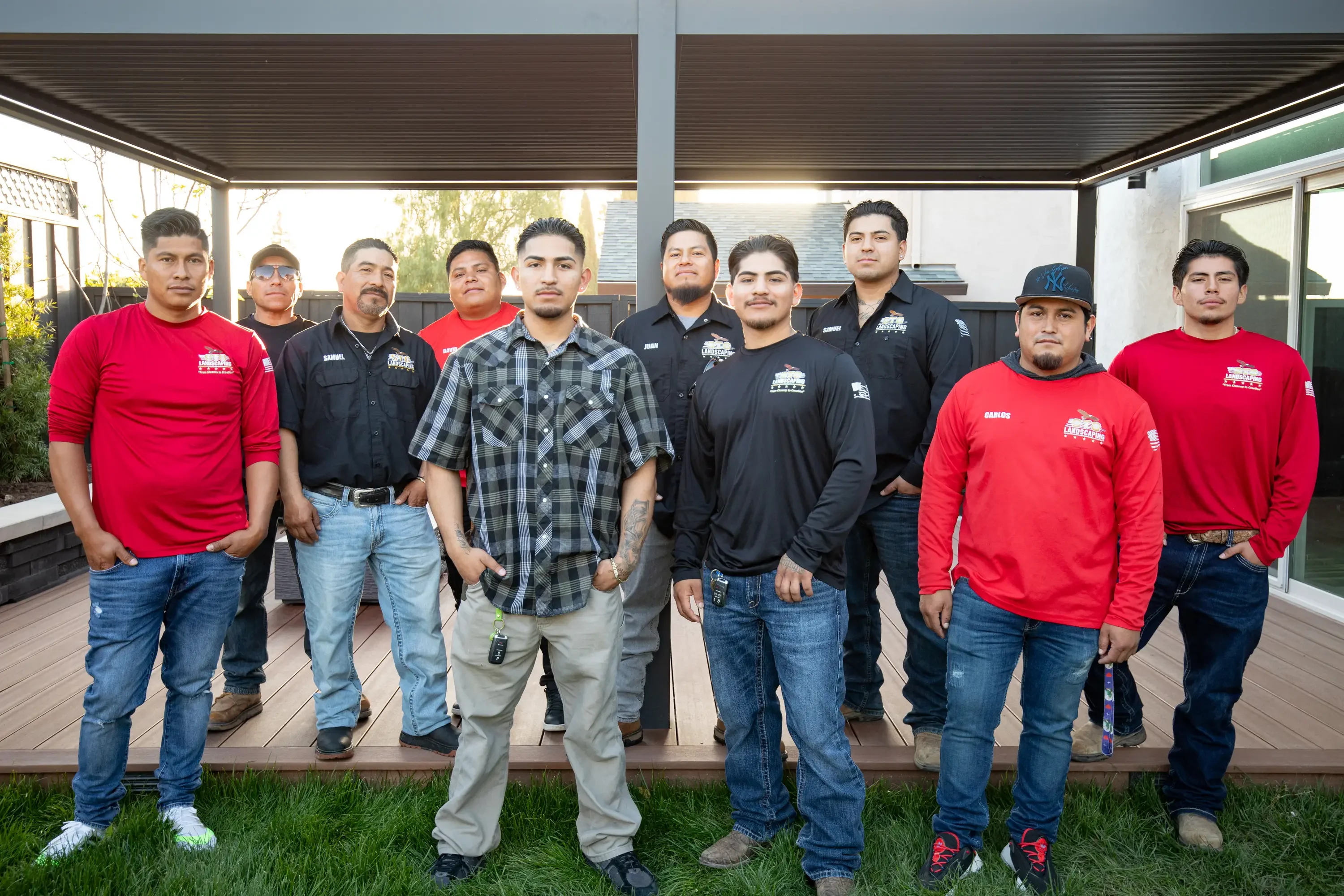 Landscaping crew with tools and equipment ready for hardscape installation work on a residential property. Landscaping crew with tools and equipment ready for hardscape installation work on a residential property.